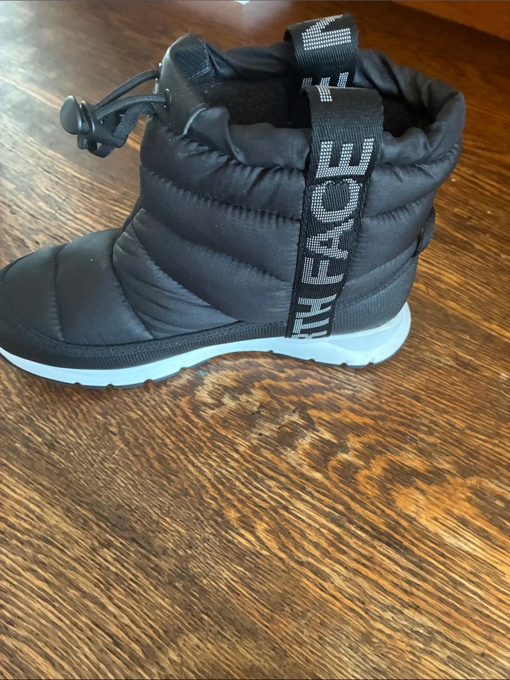 The North Face Kids Black Puffer Snow Boot with Light Gray Sole